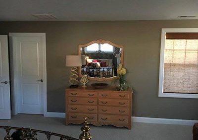 a bedroom with newly painted gray walls