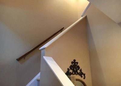 a stairway with gray painted walls
