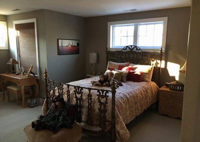 a bedroom with gray painted walls