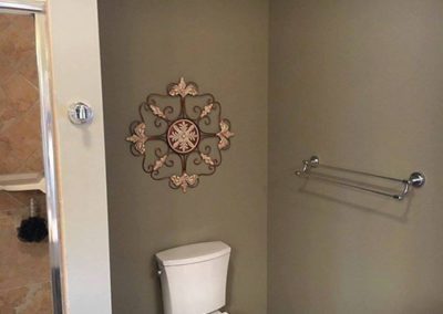 a bathroom with green painted walls