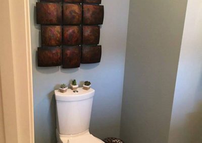 a bathroom with blue painted walls