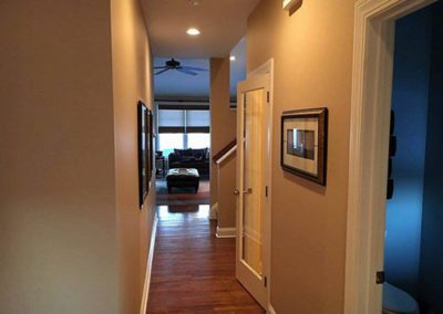 a hallway with peach color walls