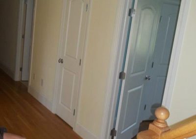 a hallway with yellow painted walls