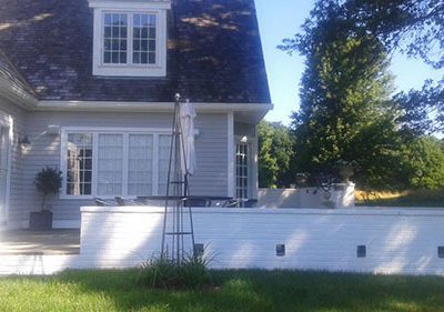 backyard with newly painted retaining wall