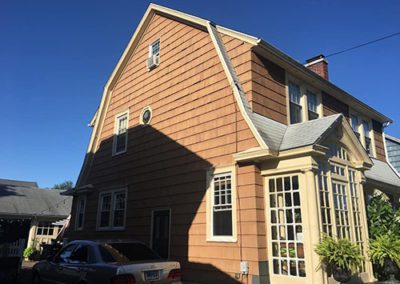 side view of a newly painted siding on a house
