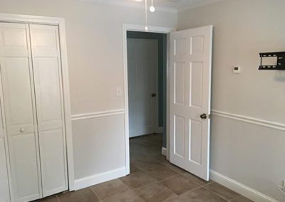 an empty bedroom with new painted walls