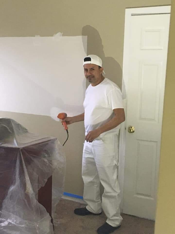 FB_IMG_1620510508427 Man Painting a Wall