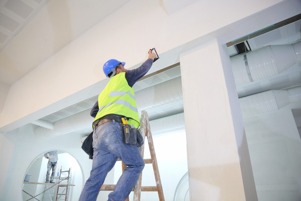 a man painting a wall
